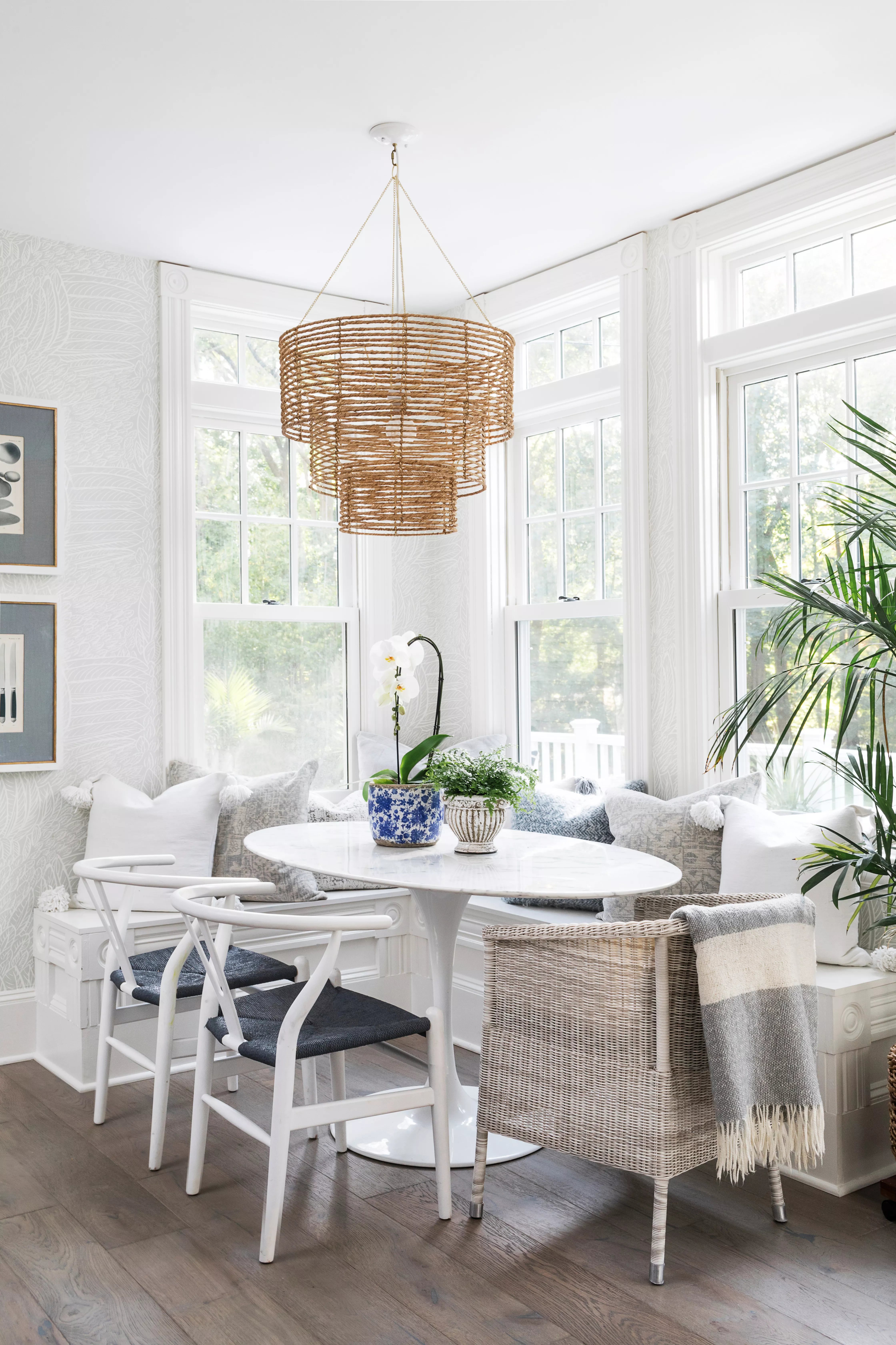 white dining room with rattan light